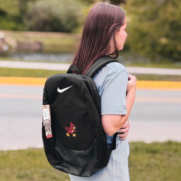 Student wearing Nike Walking Cy Brasilia Backpack